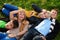 Group of four young people laying in the grass