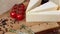 Group of french aged delicatessen cheeses on wooden table intro motion slow hidef hd