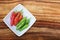 Group of fresh chili`s in a white bowl viewed from the top with