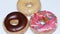 A group of fresh decorated donuts on a white background