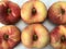 Group of fresh doughnut peaches fruits