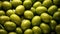 Group of Fresh Harvested Green Olives with Water Drops As Pattern Background