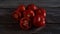 A group of Fresh and Healthy Ripe Red Tomatoes on wooden Table.