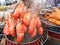 group of fresh juicy giant shrimps prawns steaming on hot water rack at thai market