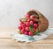 Group of fresh radish in a basket on the table.