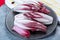 Group of fresh red Radicchio chicory or Belgian endive vegetables, also known as witlof salade