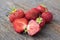 Group of fresh red strawberries on wooden table. Clean, delicious and ready to eat