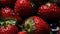 Group of Fresh Red Strawberry Fruits with Water Drops As Defocused Background