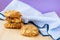 Group of freshly baked biscuits with cereal on violet background. Concept of healthy snack