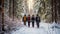 A group of friends with backpacks walking through the winter forest