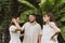 A group of friends communicates on the patio, green background. Spending time on the summer veranda