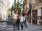 Group Of Friends Crossing Urban Street In New York City