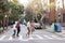 Group Of Friends Crossing Urban Street In New York City