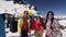 Group of friends dance on camera. Ski resort. Encamp. Sunny day. People relax