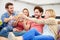 Group Of Friends Enjoying Glass Of Wine At Home