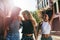 Group of friends enjoying outdoors on city street