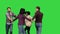 A group of friends fooling around, dancing in a ring, having fun on a Green Screen, Chroma Key.