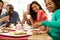 Group Of Friends Having Cheese And Coffee At Dinner Party