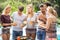 Group of friends having hamburgers and juice