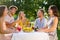 Group of friends having a picnic break in the countryside