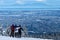 Group of friends hiking Cypress Mountain looking at Vancouver Downtown view in winter.