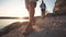 Group of friends hiking on rocky coastline