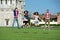 Group of Friends Jumping with Pisa Leaning Tower