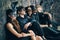 Group of friends in masquerade carnival mask sitting on floor relax after party