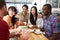 Group Of Friends Meeting In Coffee Shop