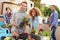 Group Of Friends Planting Rooftop Garden Together