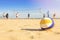 Group of friends playing beach volleyball