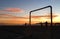 Group of friends playing football on the beach during a magnificent summer sunset in Santos