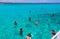 Group of friends relaxing together on a party boat tour of the Carribean Sea