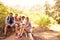 Group Of Friends Resting On Walk Through Countryside