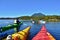 Group of friends on sea kayak in Pacific Ocean near Vancouver Island.