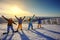 Group of friends snowboarders having fun on the top of mountain