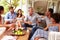 Group of friends socialising in a conservatory