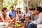 Group of friends socialising in a conservatory