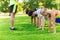 Group of friends or sportsmen exercising outdoors