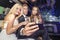 Group of friends taking a selfie in limousine