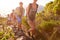 Group Of Friends Walking Along Coastal Path Together