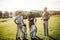 Group of friends walking on the golf course