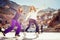 Group funny teenagers girls ice skating outdoor at ice rink