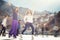 Group funny teenagers girls ice skating outdoor at ice rink