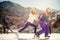 Group funny teenagers ice skating outdoor at ice rink