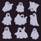 A group of ghosts isolated on a dark background. Halloween characters. Vector illustration in cartoon
