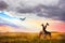 Group of giraffes and Marabou stork in the Serengeti National Park. Sunset background