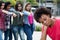 Group of girls bullying an african american woman