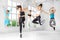 A group of girls jumping to dance in the dance class. The concept of sports, a healthy lifestyle, fitness, stretching and dancing