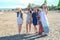 Group of girls looking away at the beach